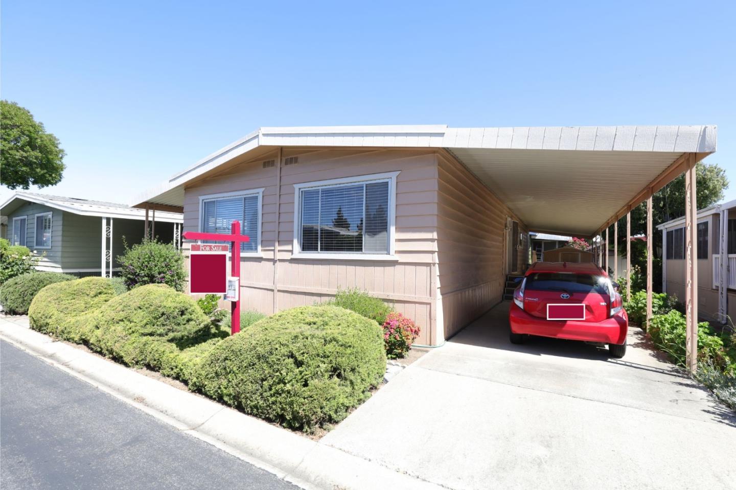 61 Quail Hollow Drive, Unit 61 San Jose, CA 95128 - Photo 2 of 36 a front view of a house with a yard