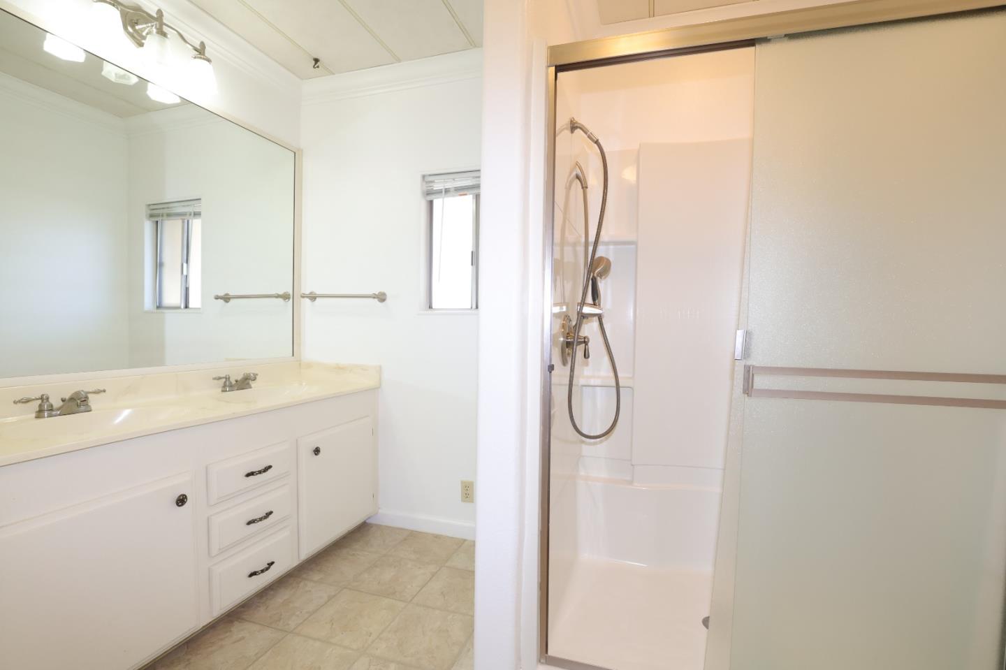 61 Quail Hollow Drive, Unit 61 San Jose, CA 95128 - Photo 26 of 36 a bathroom with a double vanity sink and mirror