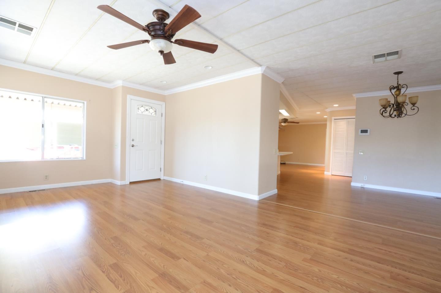 61 Quail Hollow Drive, Unit 61 San Jose, CA 95128 - Photo 28 of 36 a view of an empty room and window with wooden floor