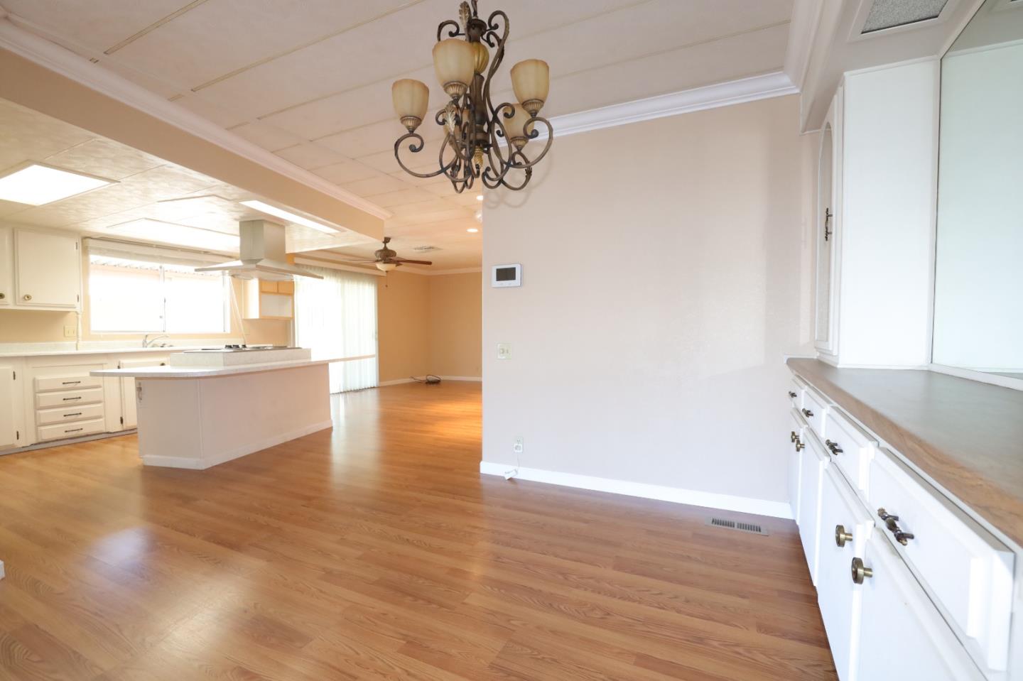 61 Quail Hollow Drive, Unit 61 San Jose, CA 95128 - Photo 30 of 36 a view of a kitchen with a sink hardwood floor and a large window