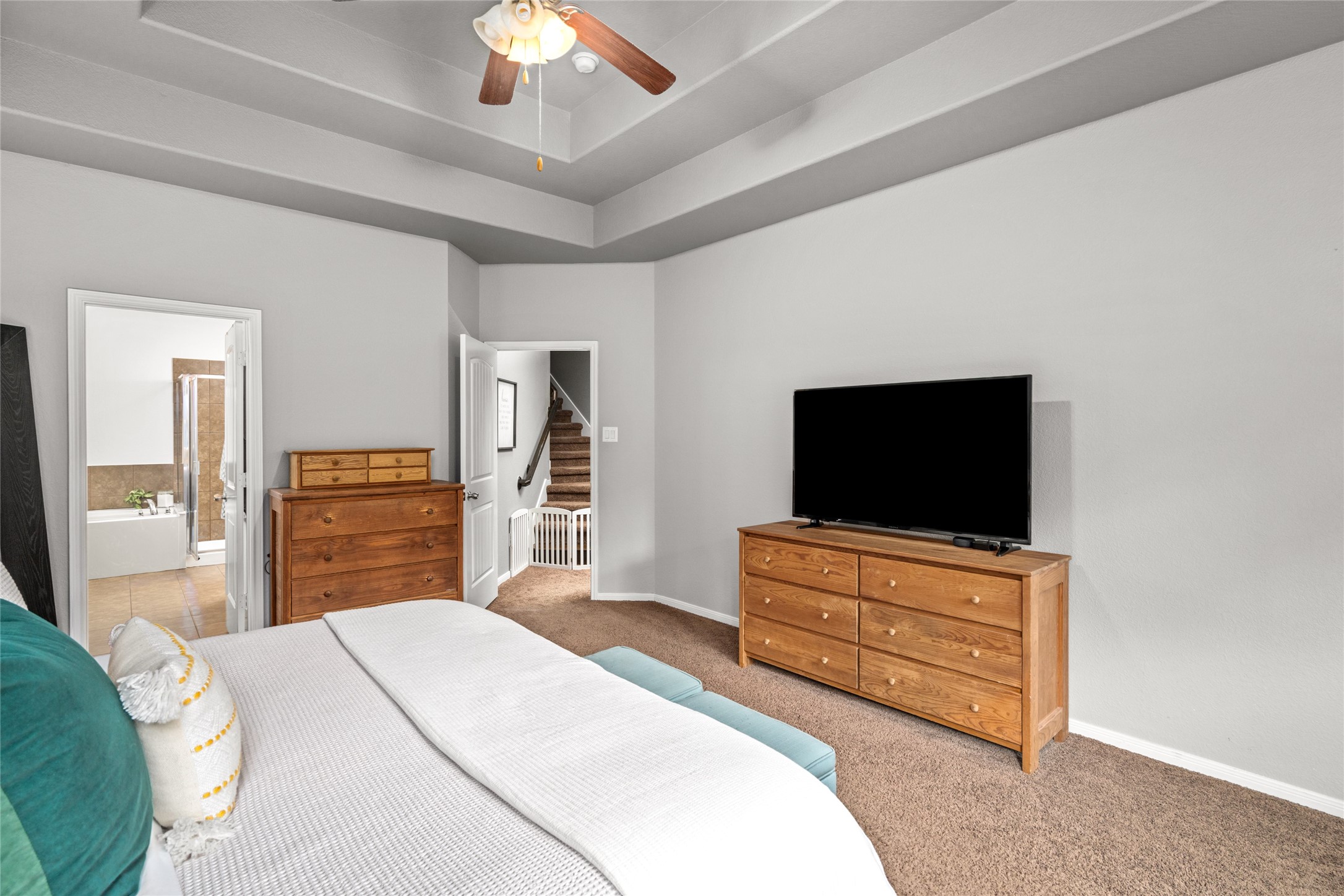 1071 Cedar Lake Court Conroe, TX 77384 - Photo 16 of 43 a bedroom with a bed and a flat screen tv