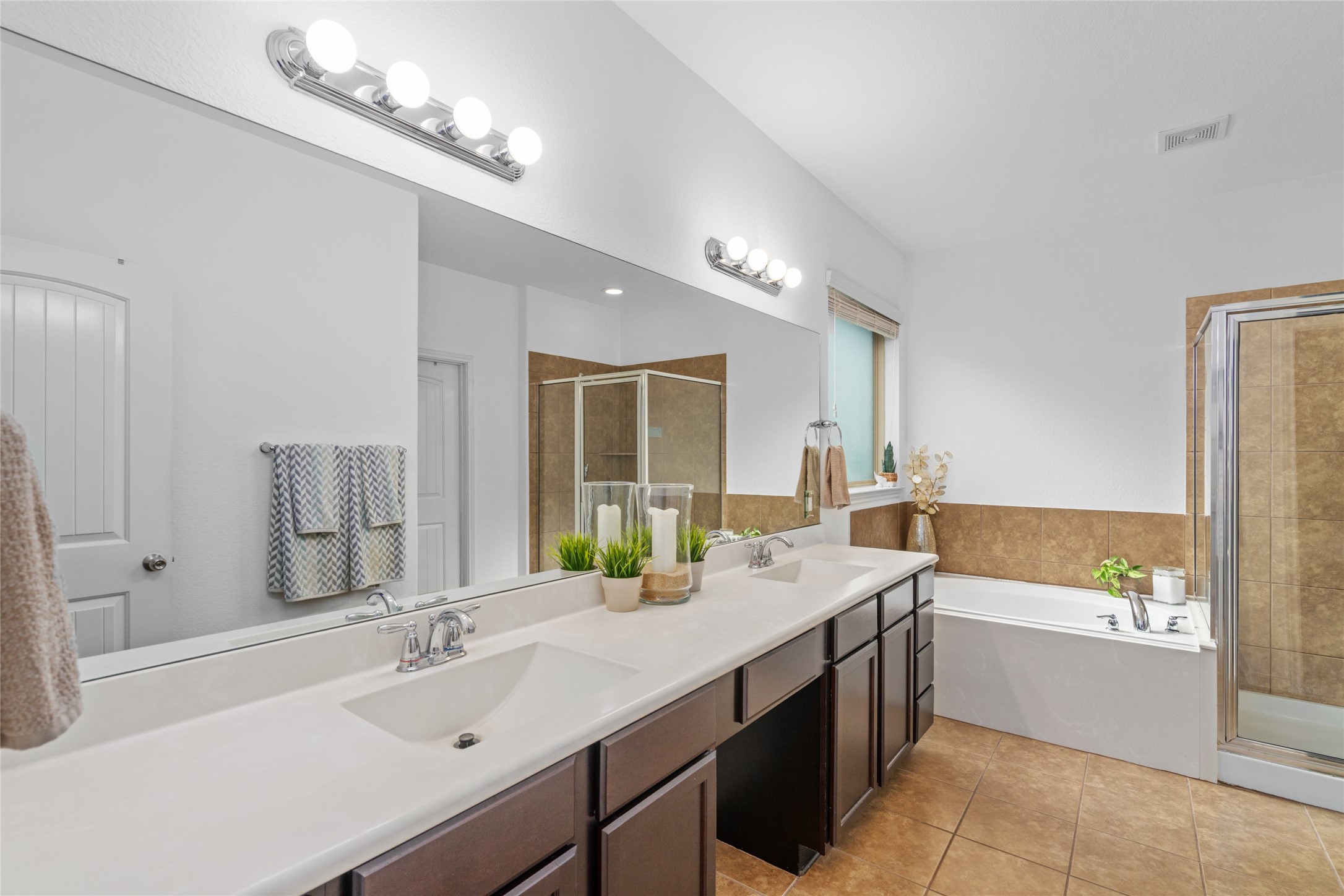 1071 Cedar Lake Court Conroe, TX 77384 - Photo 17 of 43 a bathroom with a tub sink and mirror