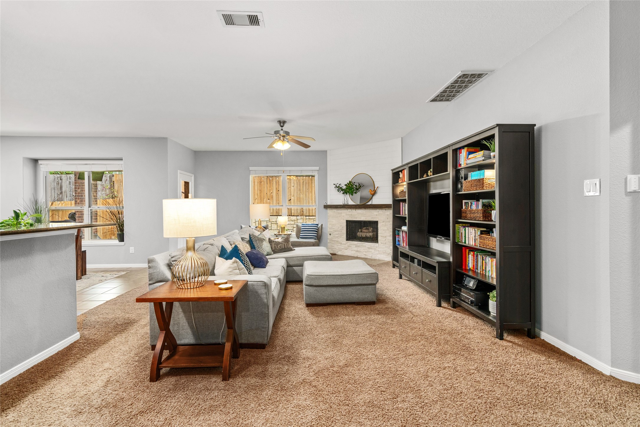 1071 Cedar Lake Court Conroe, TX 77384 - Photo 2 of 43 a living room with furniture and a flat screen tv