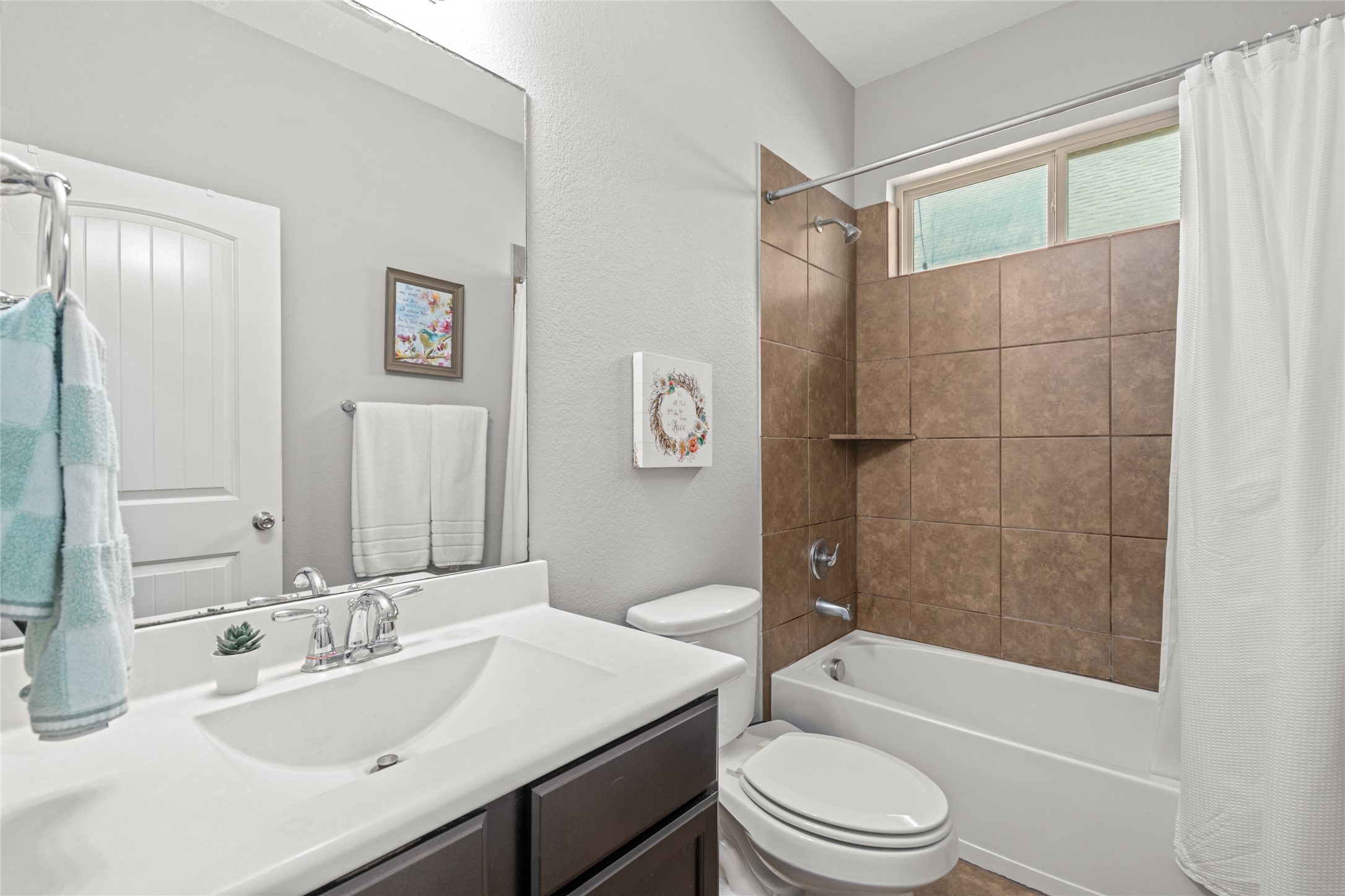 1071 Cedar Lake Court Conroe, TX 77384 - Photo 21 of 43 a bathroom with a sink a toilet and shower