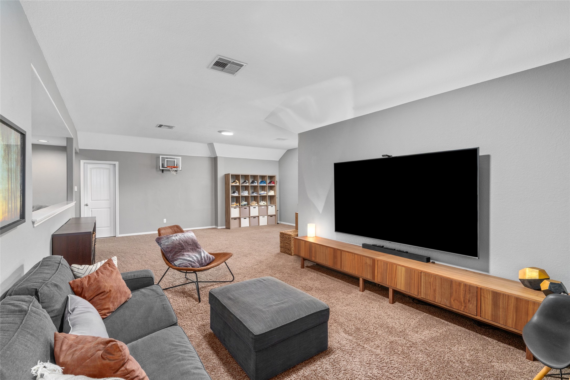 1071 Cedar Lake Court Conroe, TX 77384 - Photo 23 of 43 a living room with furniture and a flat screen tv