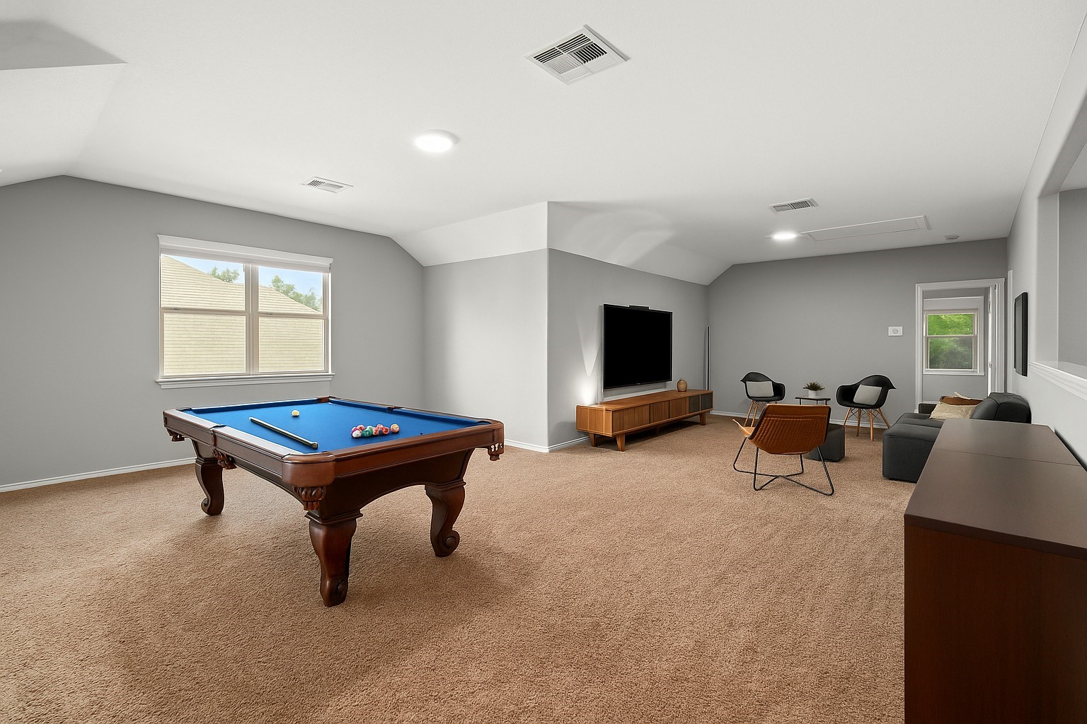 1071 Cedar Lake Court Conroe, TX 77384 - Photo 24 of 43 a living room with furniture pool table and a flat screen tv