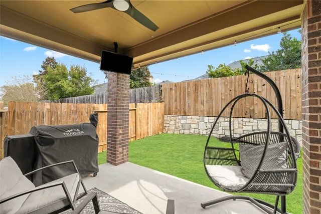 a backyard of a house with seating space