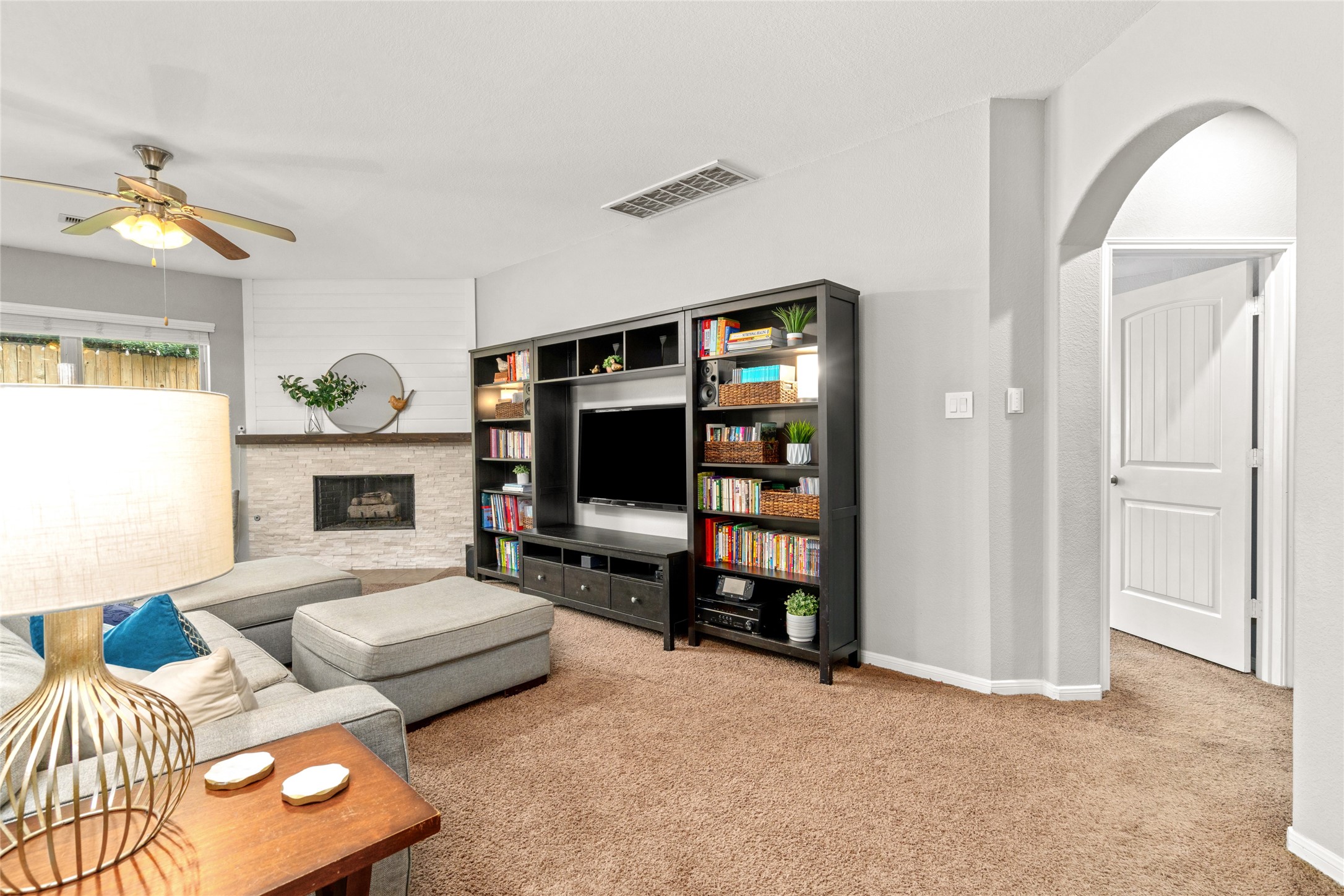1071 Cedar Lake Court Conroe, TX 77384 - Photo 8 of 43 a living room with furniture and a flat screen tv