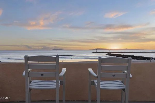 a view of a balcony with chairs