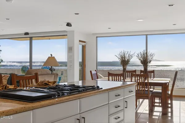 a view of a dining room with furniture window and outside view
