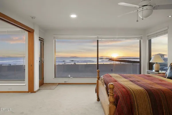 a living room with a large window and a table
