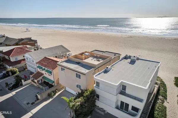 a front view of residential houses with street
