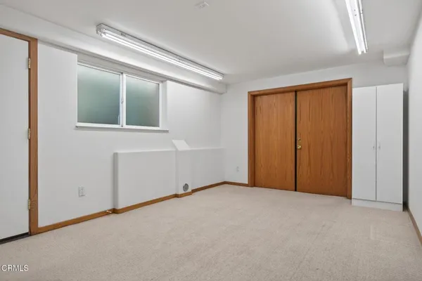 a bathroom with a granite countertop sink shower and a mirror