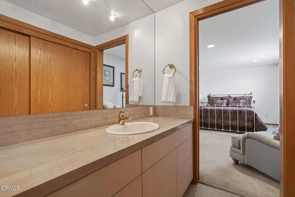 a view of water heater and a car parked in a yard