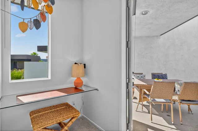 a room with a table and a lamp