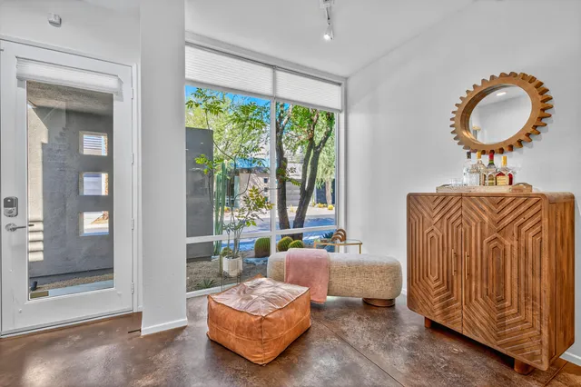 a living room with furniture and a large window