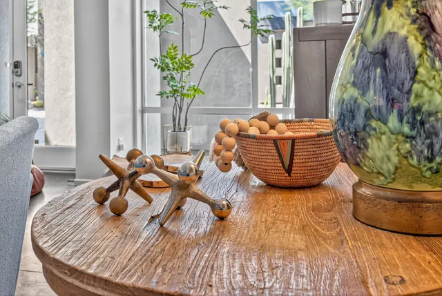 a living room with furniture and a potted plant