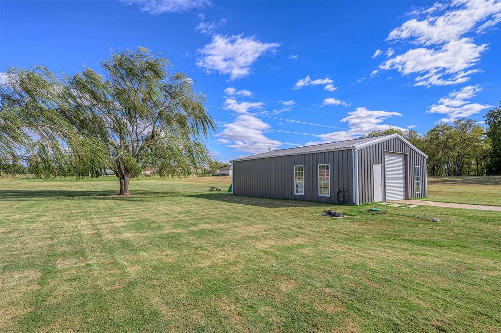 10264 Farmington Road Van Alstyne, TX 75495 - Photo 30 of 39 a house view with a garden space