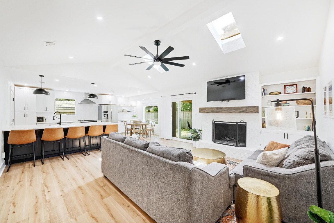 1006 South Riviera Circle Cedar Park, TX 78613 - Photo 1 of 1 a living room with furniture a fireplace and a flat screen tv