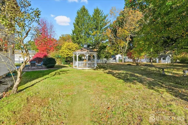 a house view with swimming pool