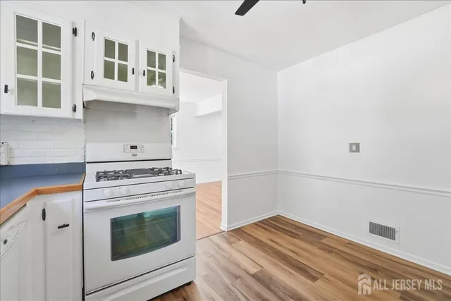 a kitchen with cabinets and appliances