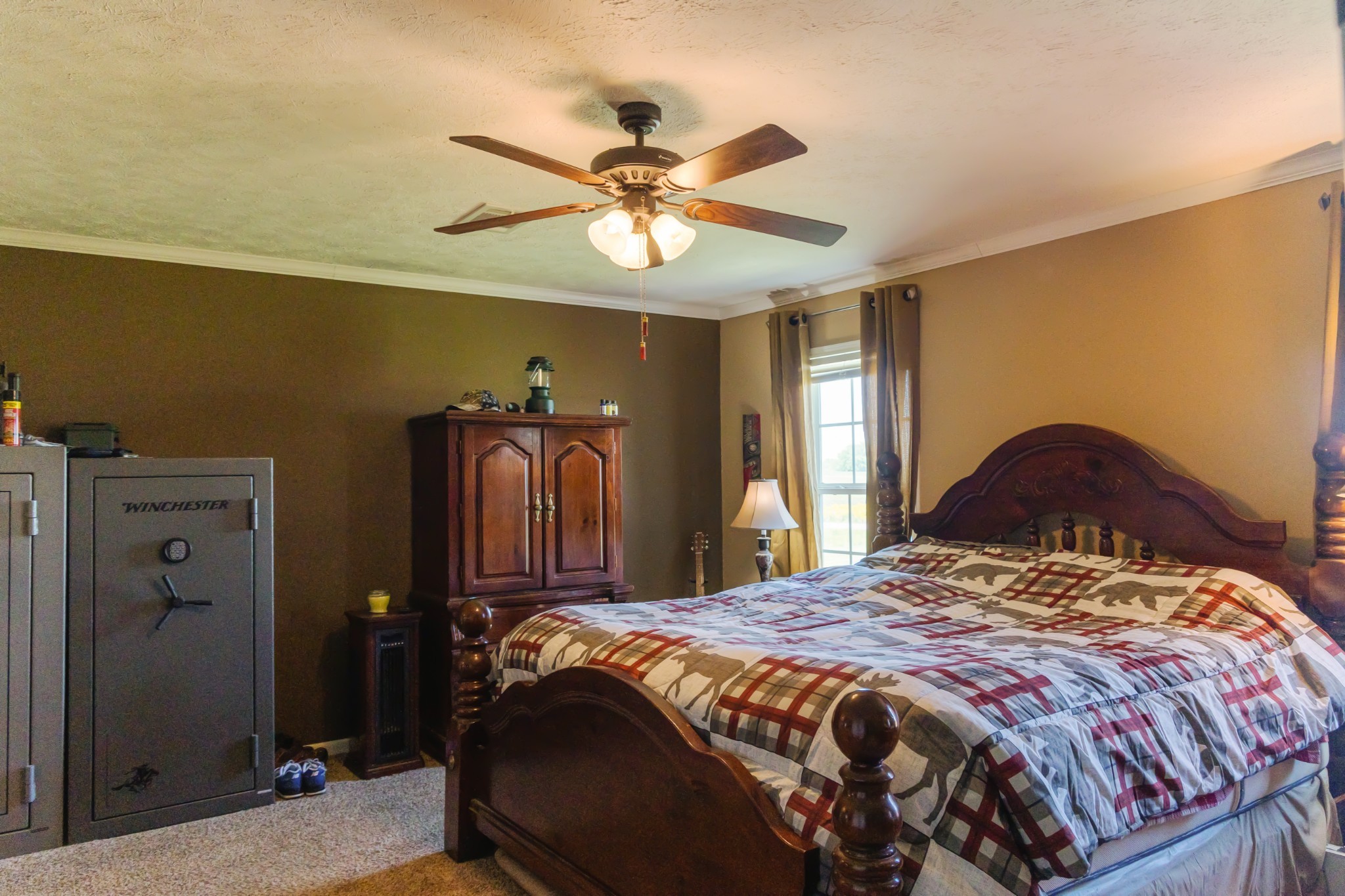 783 White Road Portland, TN 37148 - Photo 11 of 20 a bedroom with a bed and a chandelier