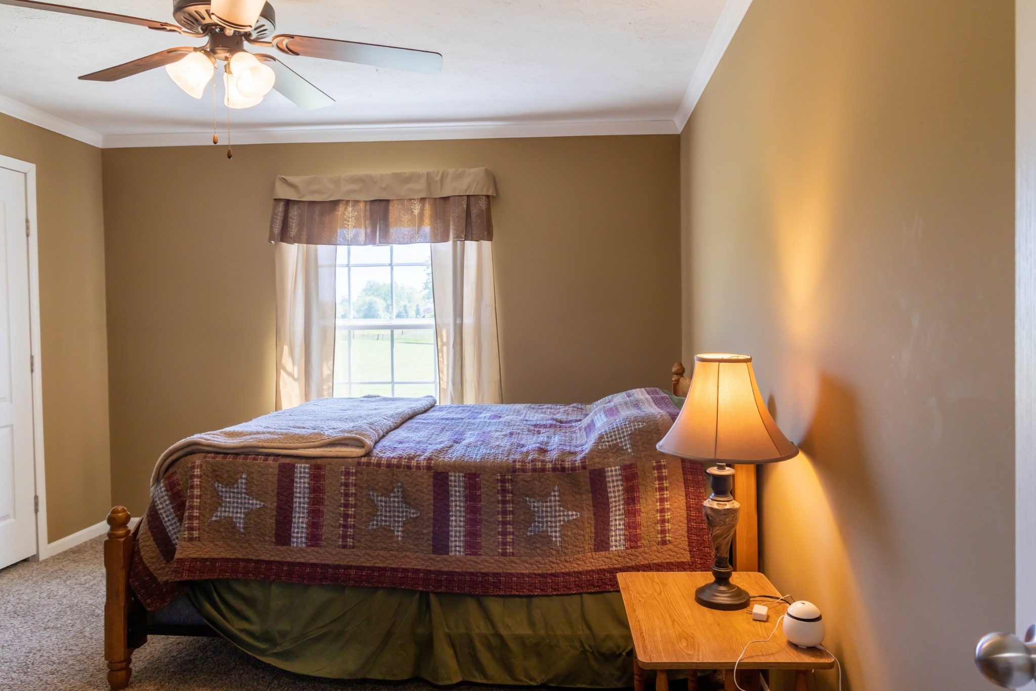 783 White Road Portland, TN 37148 - Photo 16 of 20 a bedroom with a bed and a lamp