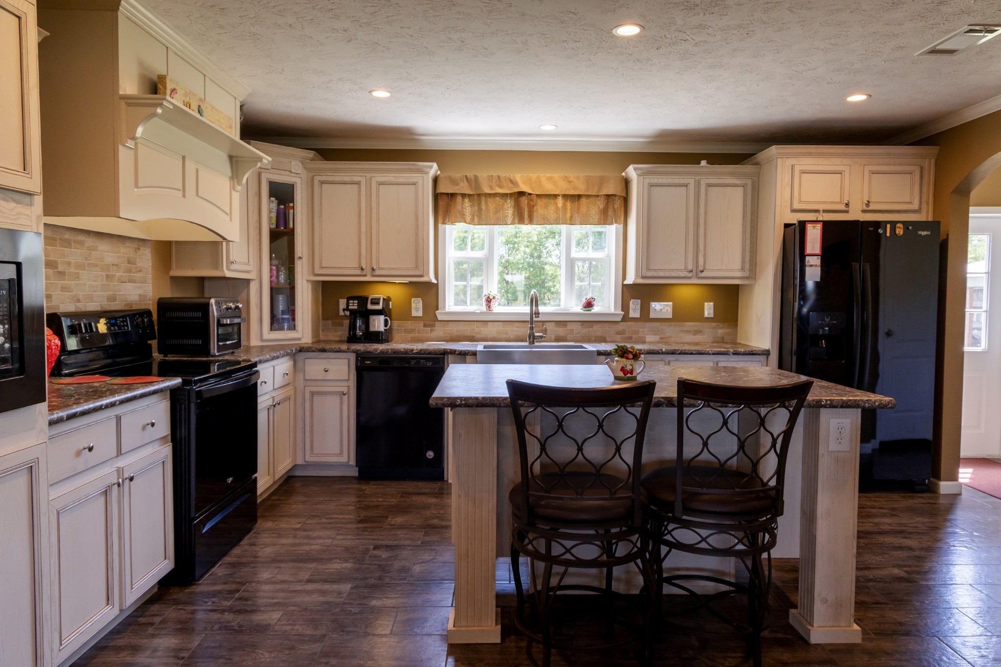 783 White Road Portland, TN 37148 - Photo 6 of 20 a kitchen with stainless steel appliances kitchen island granite countertop a table chairs sink refrigerator and cabinets