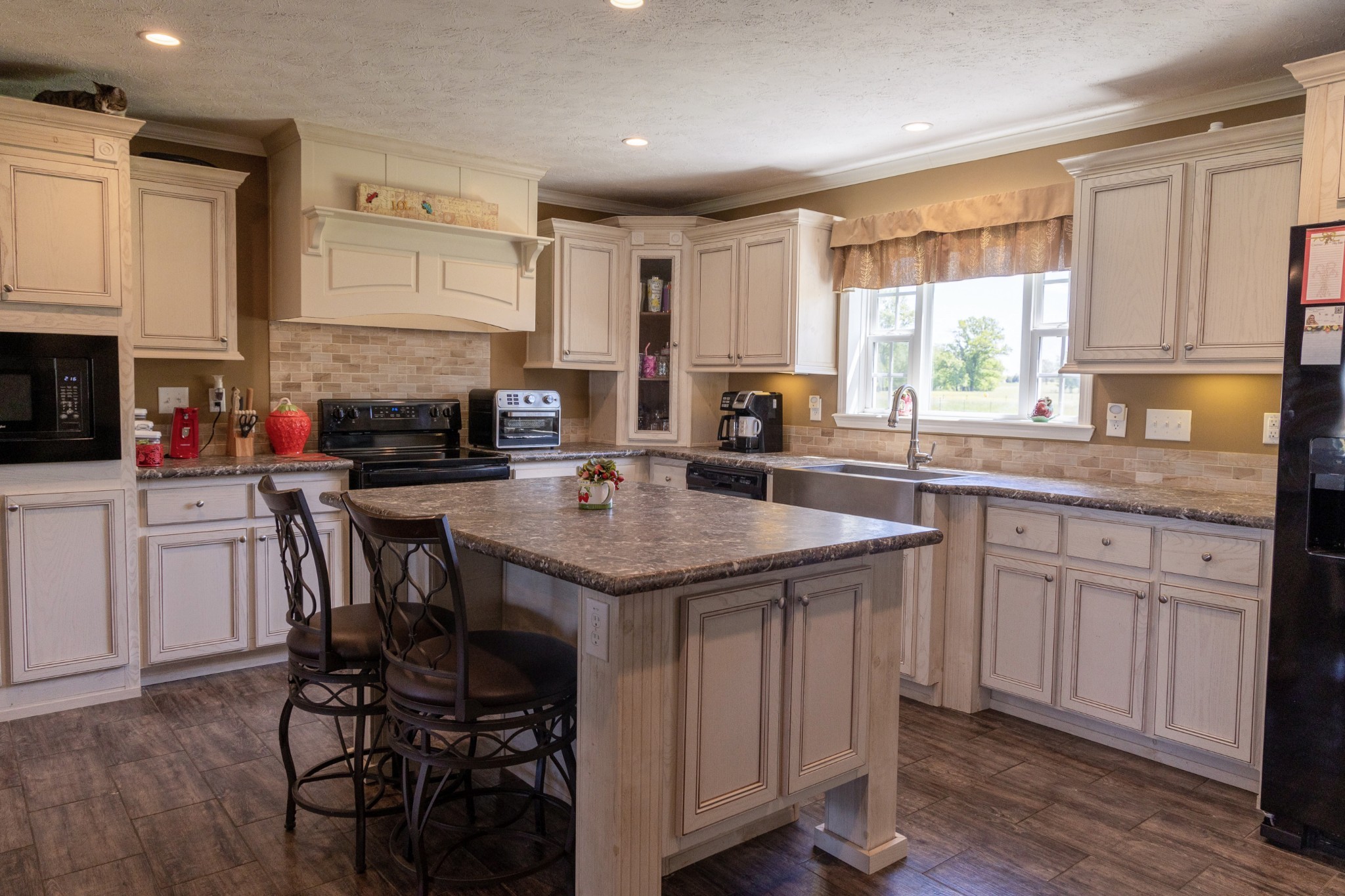 783 White Road Portland, TN 37148 - Photo 7 of 20 a kitchen with stainless steel appliances granite countertop a table chairs sink and cabinets
