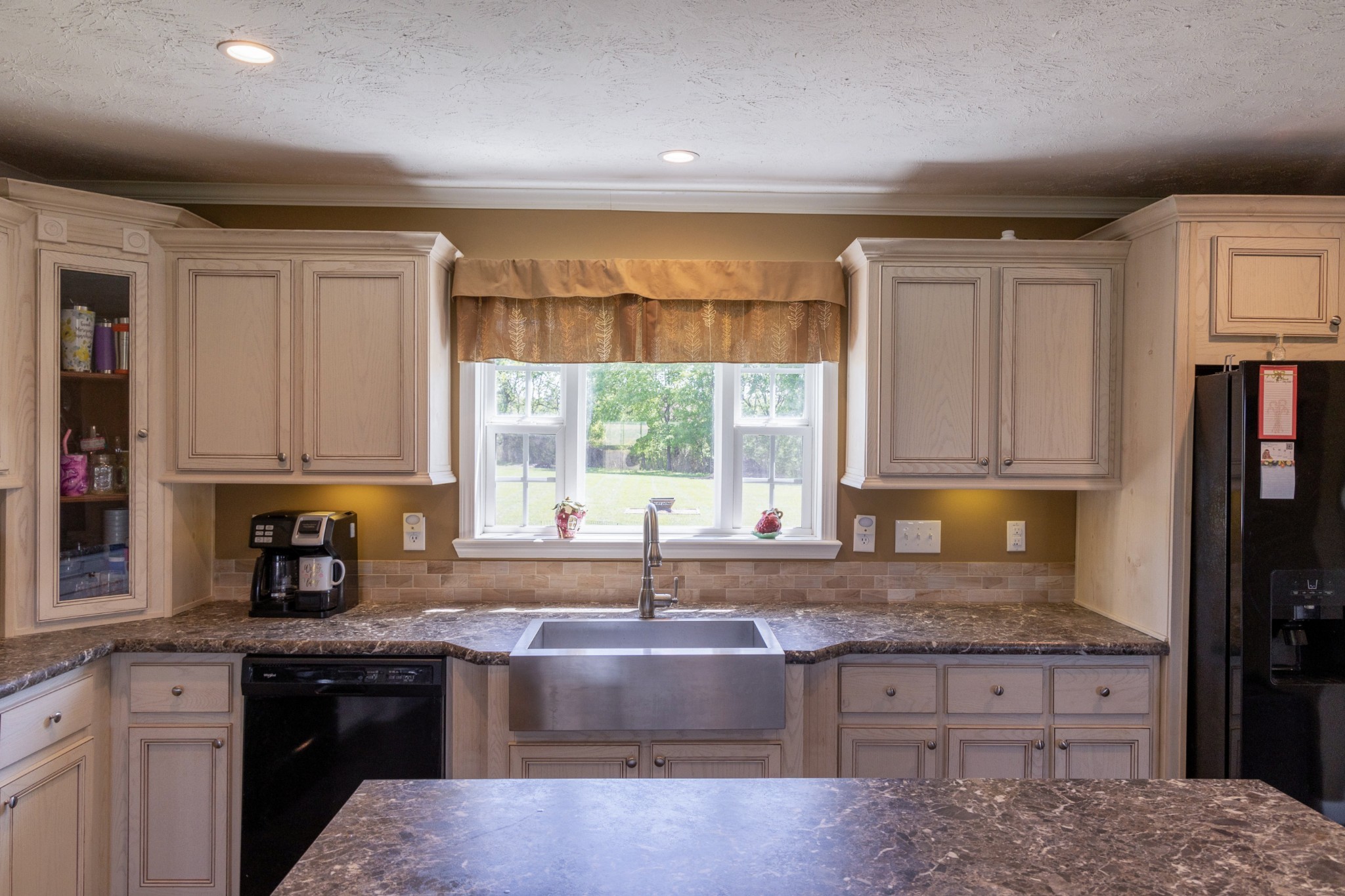 783 White Road Portland, TN 37148 - Photo 9 of 20 a kitchen with granite countertop a sink window and cabinets