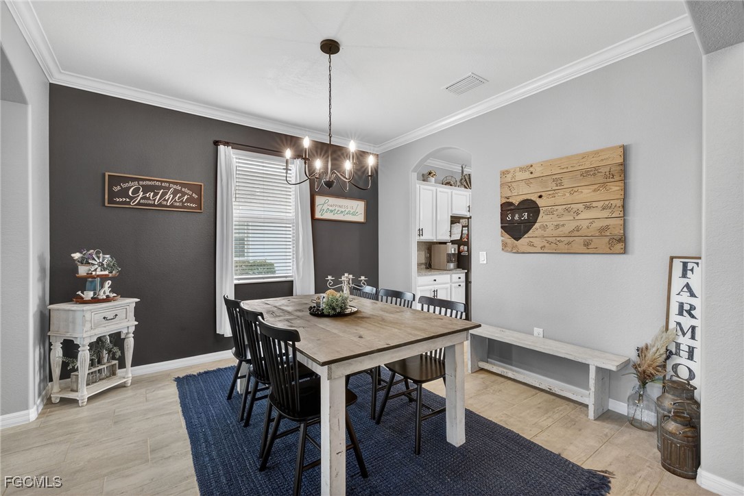 43325 Waymark Place Punta Gorda, FL 33982 - Photo 11 of 49 a view of a dining room with furniture window and wooden floor
