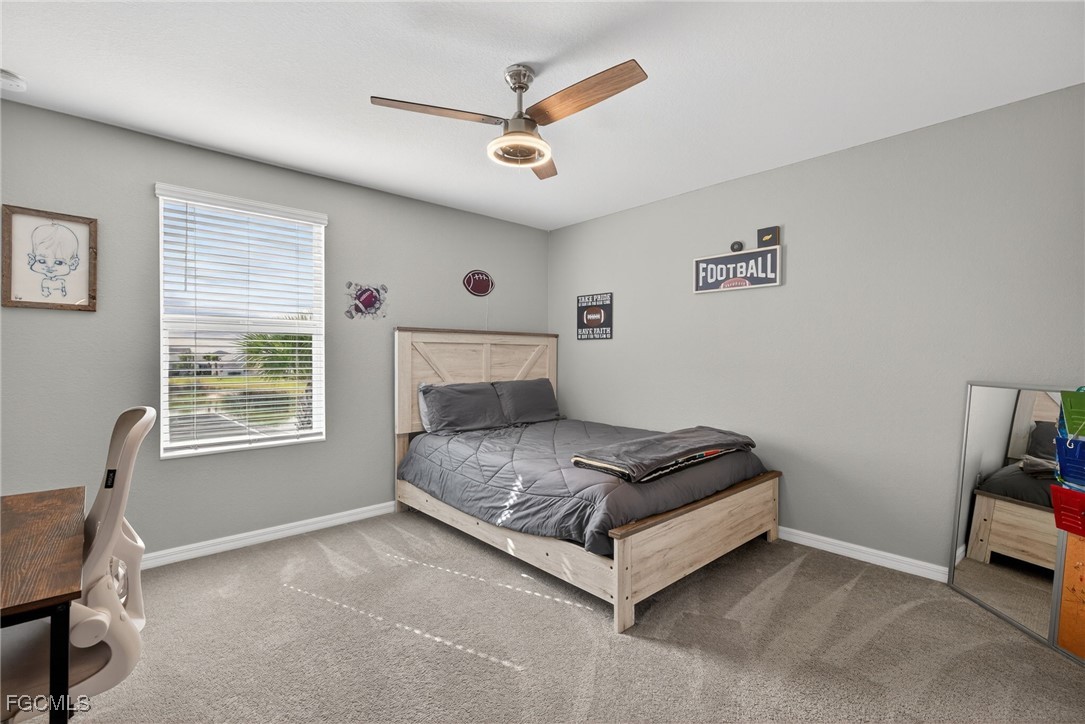 43325 Waymark Place Punta Gorda, FL 33982 - Photo 29 of 49 a bedroom with a bed and a window