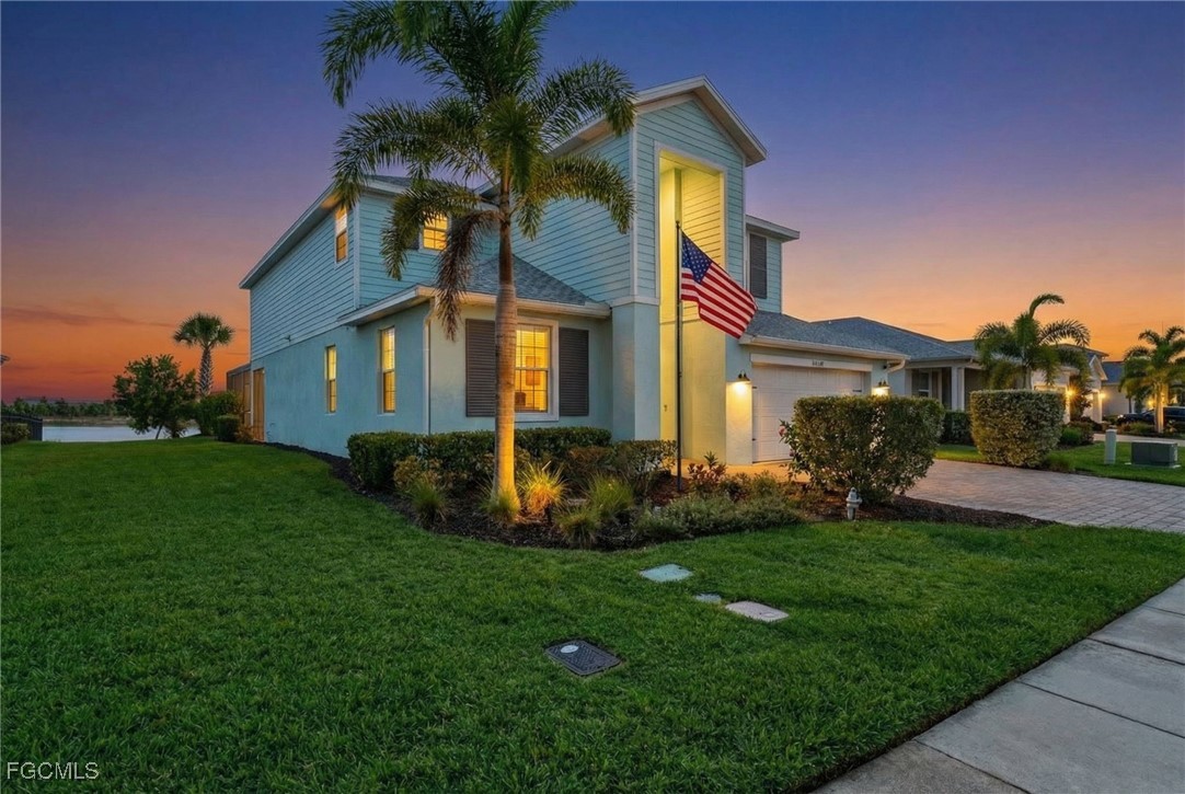 43325 Waymark Place Punta Gorda, FL 33982 - Photo 3 of 49 a front view of house with yard and green space