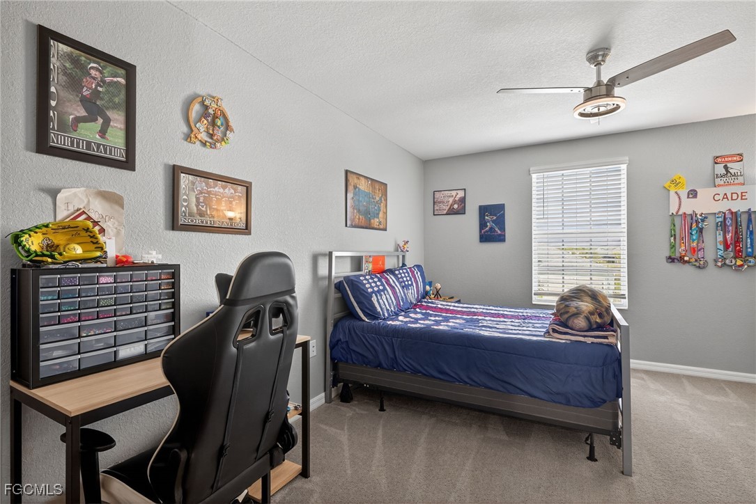 43325 Waymark Place Punta Gorda, FL 33982 - Photo 32 of 49 a bedroom with bed and a window