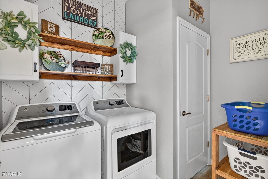 43325 Waymark Place Punta Gorda, FL 33982 - Photo 35 of 49 a utility room with dryer and washer