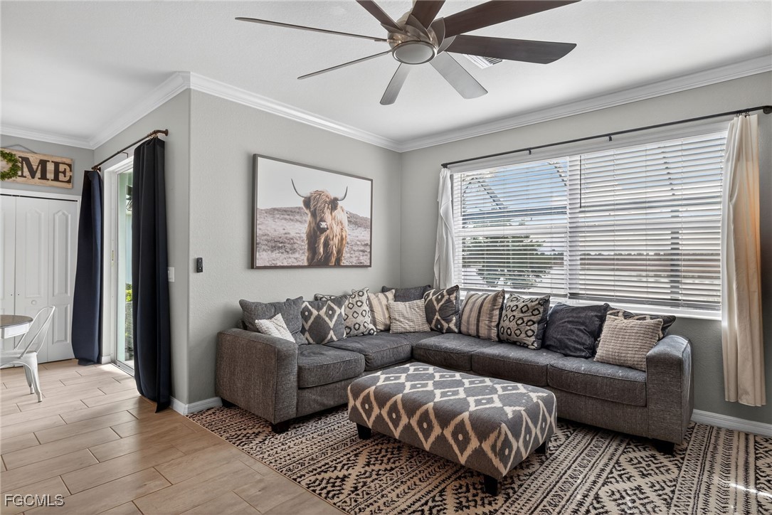 43325 Waymark Place Punta Gorda, FL 33982 - Photo 8 of 49 a living room with furniture and a large window