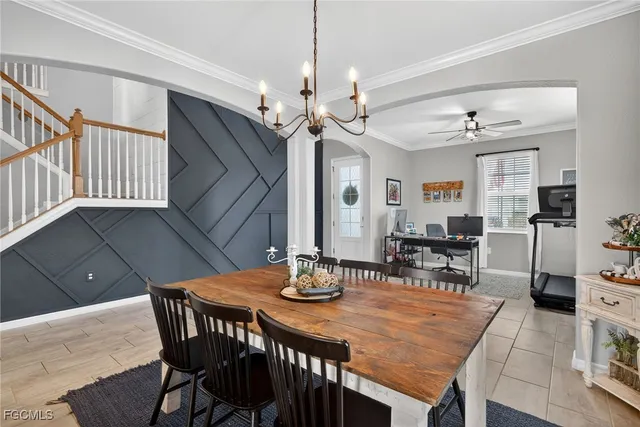 a view of a dining room with furniture and window