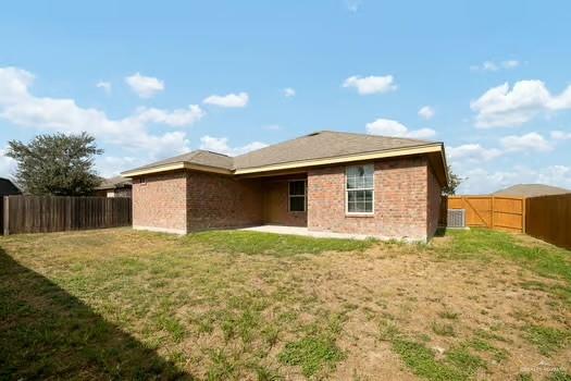 1403 Tierra Rica Avenue Alamo, TX 78516 - Photo 13 of 13 a backyard of a house with lots of green space