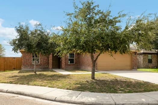 1403 Tierra Rica Avenue Alamo, TX 78516 - Photo 2 of 13 a view of a yard with plants