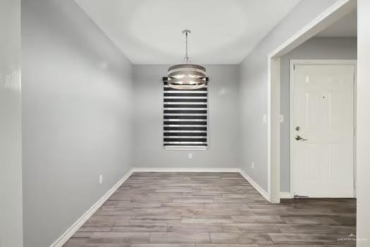 1403 Tierra Rica Avenue Alamo, TX 78516 - Photo 3 of 13 a view of a livingroom with wooden floor and windows