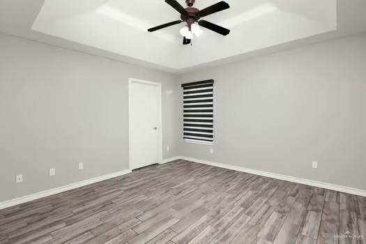 1403 Tierra Rica Avenue Alamo, TX 78516 - Photo 7 of 13 wooden floor in an empty room with a window