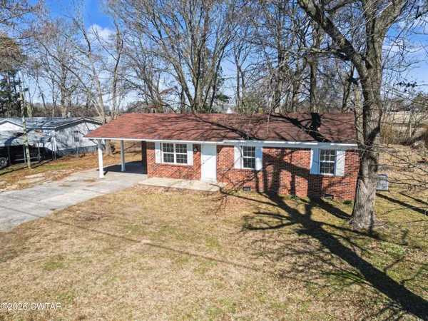 a house with trees in front of it