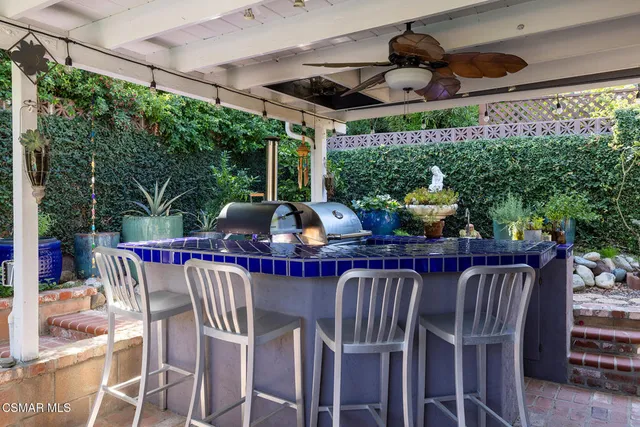 a view of an outside dining space with furniture window