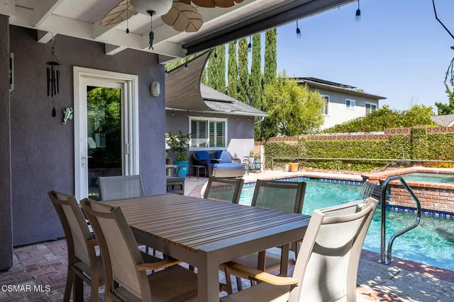 a outdoor dining space with furniture and yard