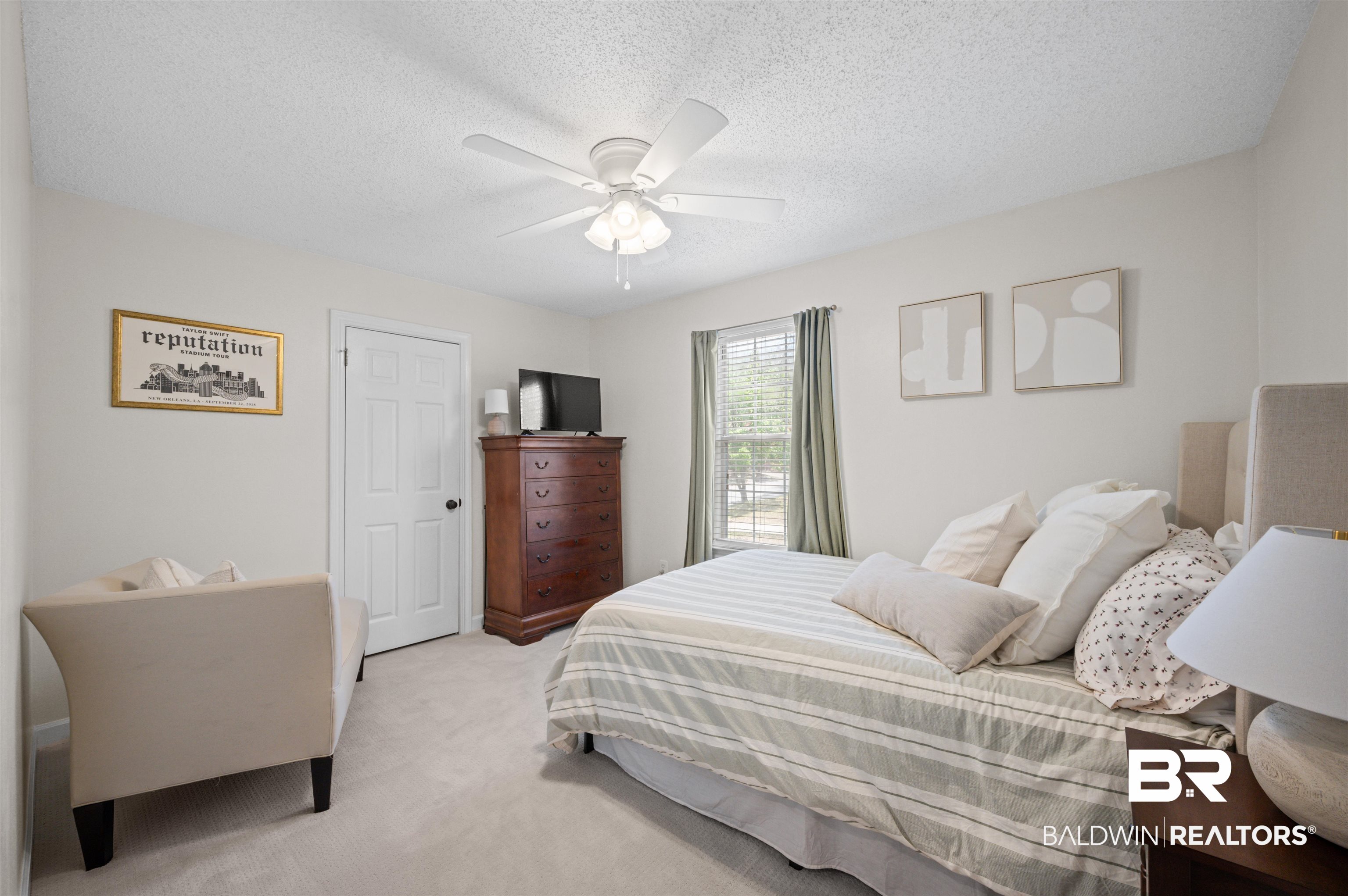 1066 Linlen Avenue Mobile, AL 36609 - Photo 15 of 22 Bedroom featuring a ceiling fan, light carpet, and a textured ceiling