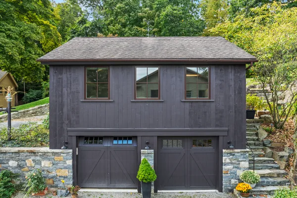 a aerial view of a house with table and chairs and potted plants