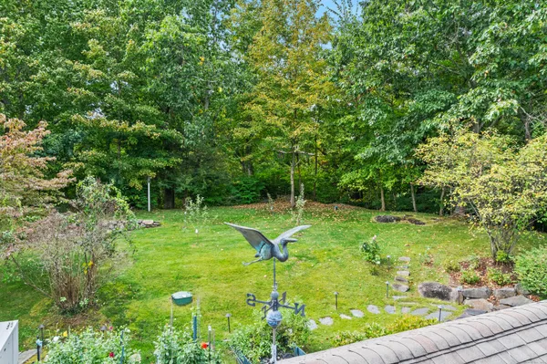 a kitchen with granite countertop a sink a stove and cabinets