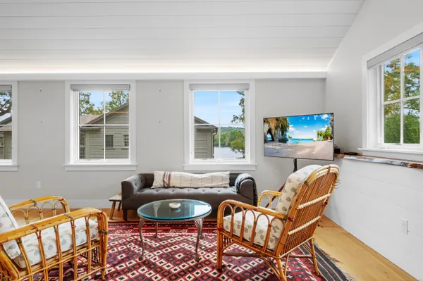 a living room with furniture and windows