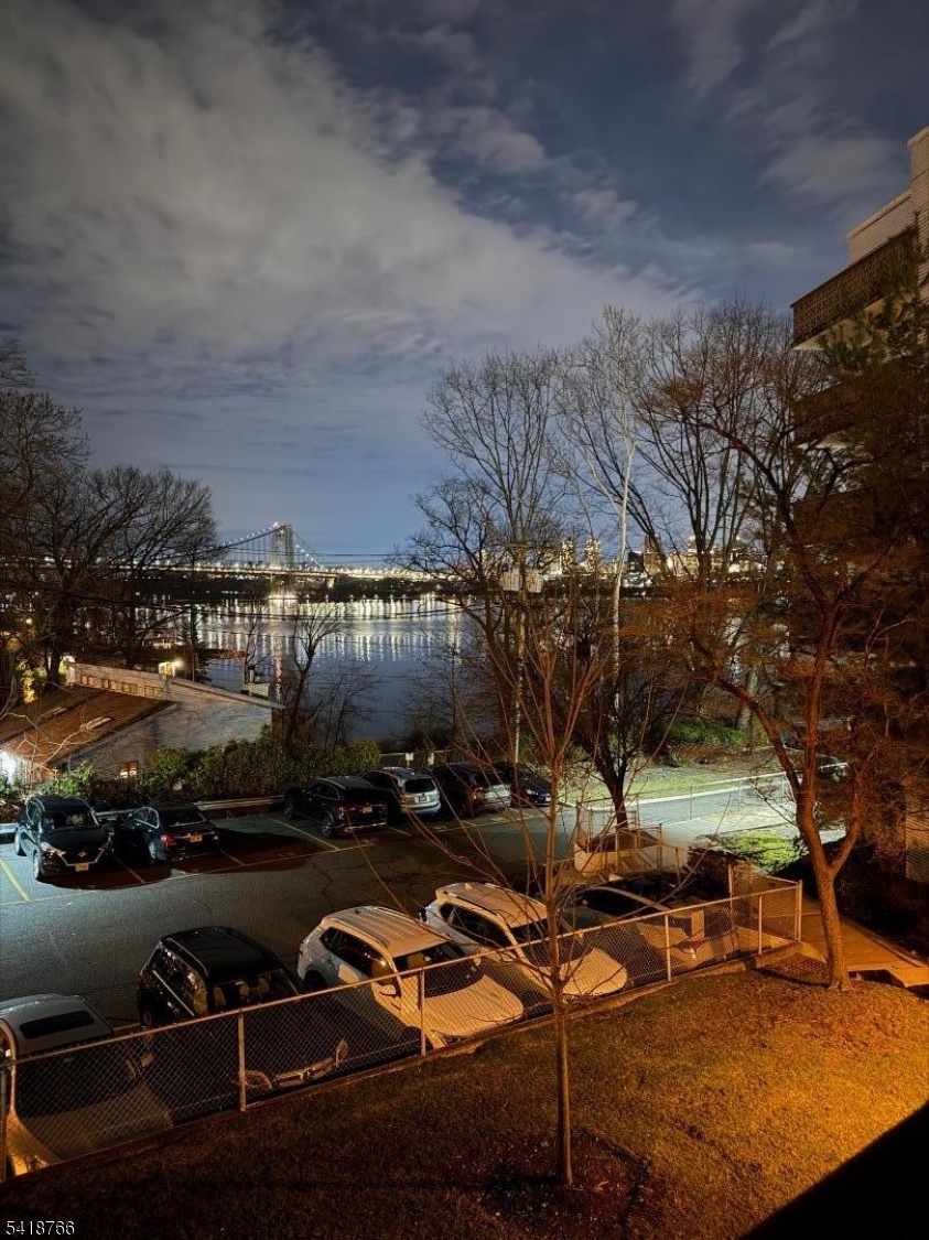 1375 River Road, Unit 2K Edgewater, NJ 07020 - Photo 11 of 13 a view of a water fountain in front of the house