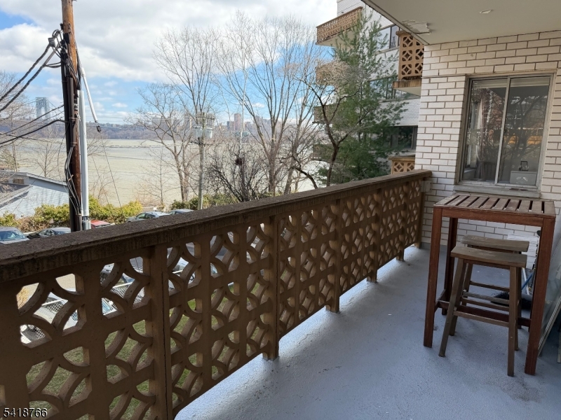 1375 River Road, Unit 2K Edgewater, NJ 07020 - Photo 10 of 13 a view of a two chair in the balcony